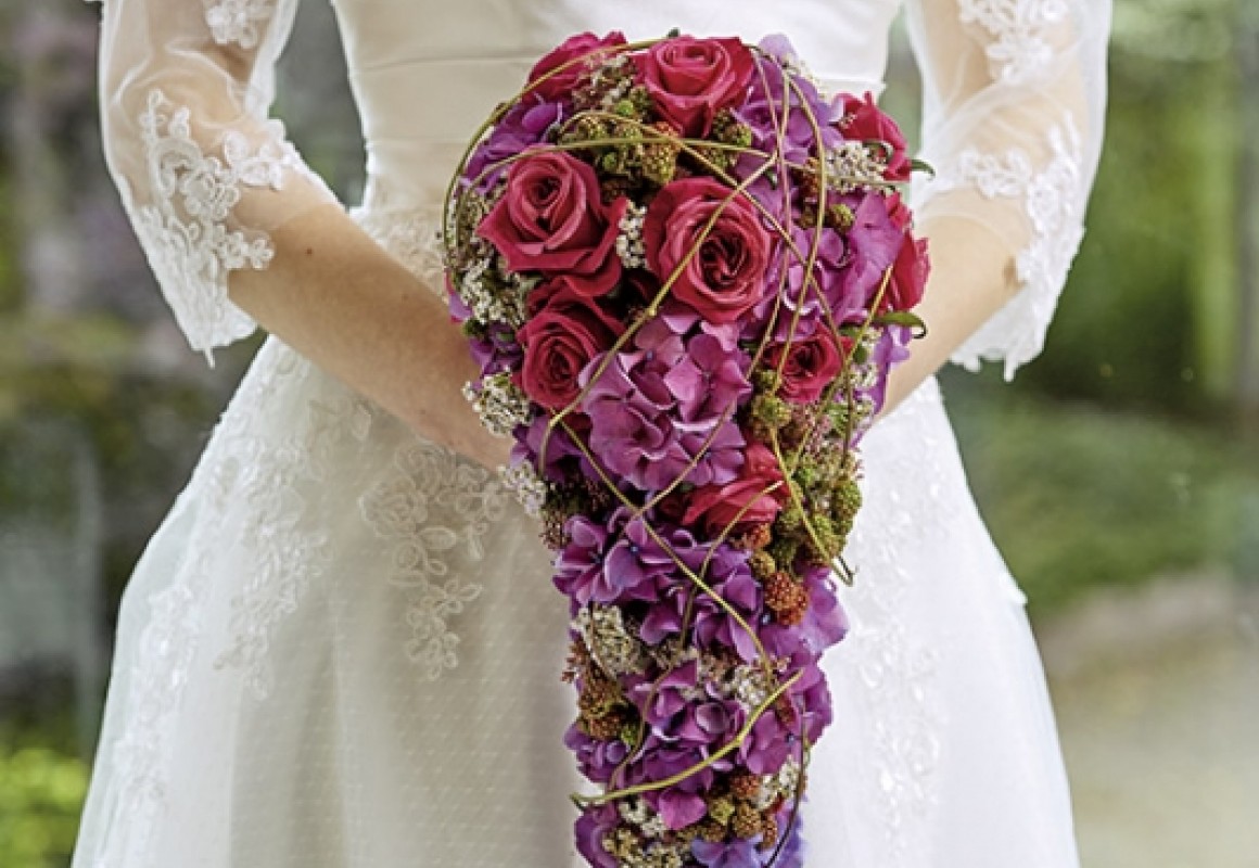 drop-shaped bridal bouquet with badges